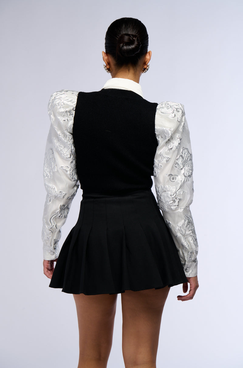 AN ELEGANT EVENING BUTTON DOWN CARDIGAN WITH BROCADE PUFF SLEEVES