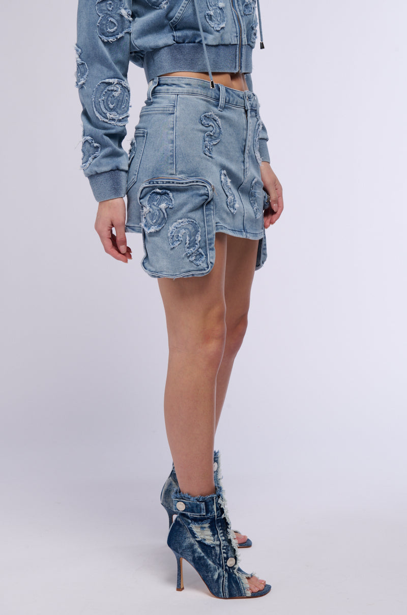 MONEY SIGNS DENIM MINI SKIRT