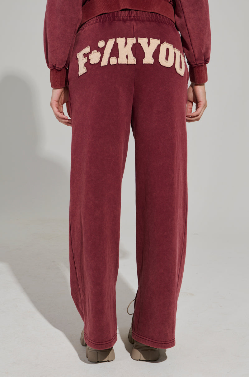 GRAPHIC LANGUAGE MINERAL WASH SWEAT PANT IN BURGUNDY