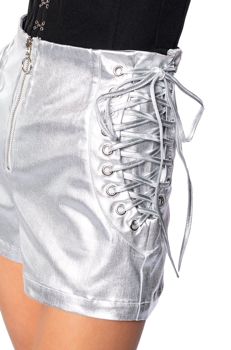 AMMO X AKIRA STAY TOGETHER METALLIC LACE UP SHORTS IN SILVER