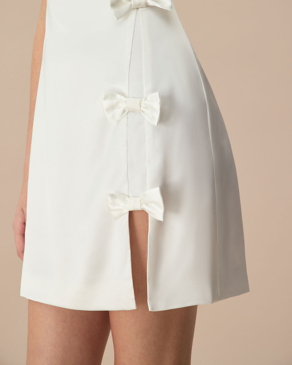 The White Boat Neck Bowknot Satin Mini Dress